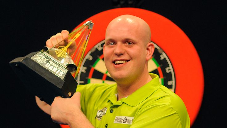 Michael van Gerwen of Holland celebrates with the trophy after winning The Final