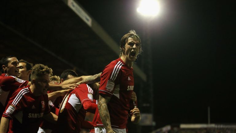 Aden Flint of Swindon Town celebrates the equalising goal scored by Miles Storey during the Capital One Cup Fourth Round match against Aston Villa in 2012