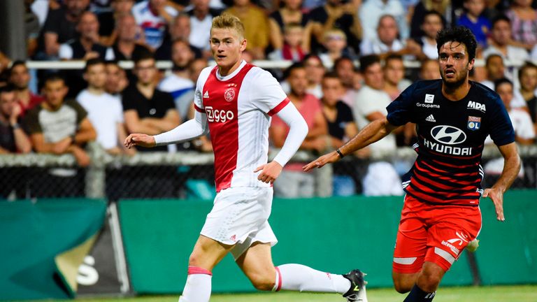Ajax defender Matthijs de Ligt vies with Lyon's French midfielder Clement Grenier during a friendly football match against Lyon 