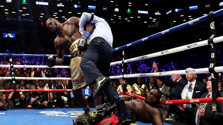 NEW YORK, NY - NOVEMBER 04:  Deontay Wilder knocks out Bermane Stiverne in the first round as referee Arthur Mercante Jr. steps in during their rematch for