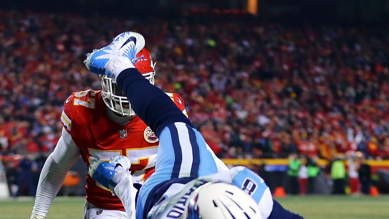 KANSAS CITY, MO - JANUARY 06:  Quarterback Marcus Mariota #8 of the Tennessee Titans dives for the end zone to score a touchdown during the AFC Wild Card p