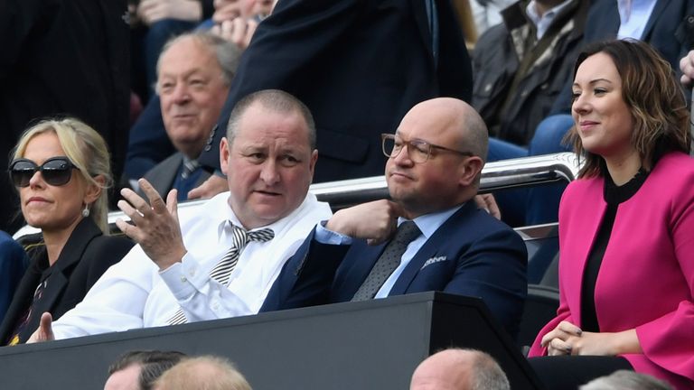 Newcastle United owner Mike Ashley (l) and the club's managing director Lee Charnley deep in conversation