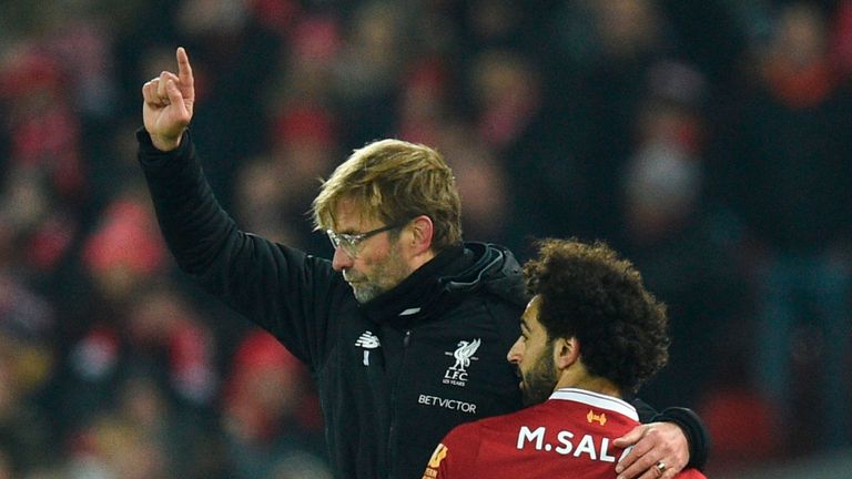 Mohamed Salah (R) goes off and embraces Liverpool manager Jurgen Klopp (L) as he passes during the Premier League match v Manchester City