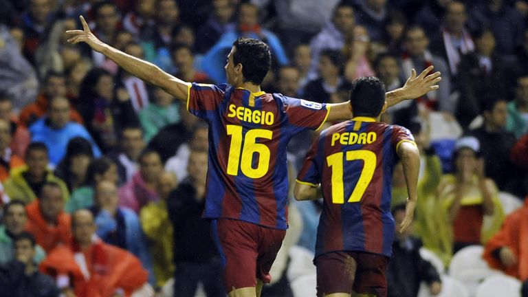 Barcelona's Sergio Busquets celebrates with team-mate Pedro Rodriguez after scoring his team's third goal during a 3-1 win over Athletic Bilbao in 2010