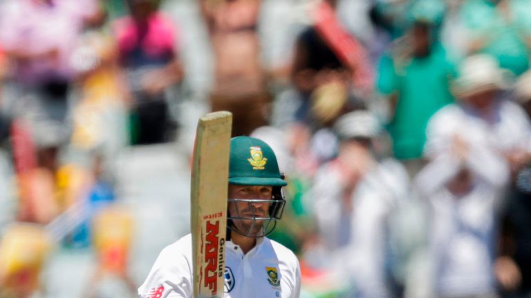 South African batsman AB de Villiers raises his bat as he celebrates scoring a Half-Century during day one of the First Test between South Africa and India