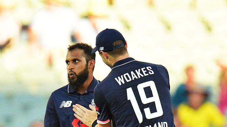 Adil Rashid of England looks on after taking a catch during game four of the One Day International series