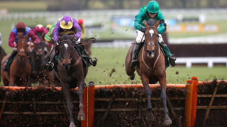 Agrapart and Lizzie Kelly (left) clear the last flight in company with Wholestone and Daryl Jacob before going on to win the Cleeve Hurdle