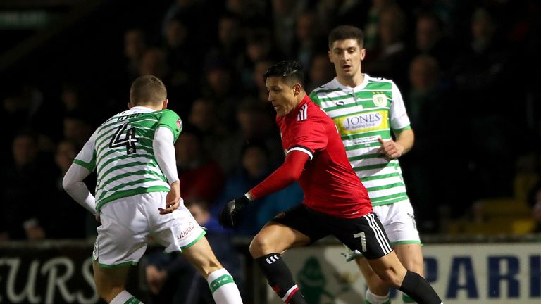 Manchester United's Alexis Sanchez (centre) and Yeovil Town's Jared Bird (left) battle for the ball