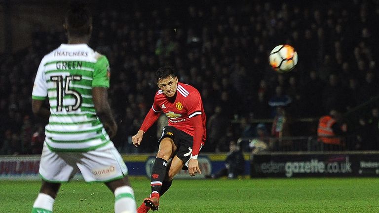 Manchester United's Chilean striker Alexis Sanchez (R) hits a freekick at goal during the FA Cup fourth round football match between Yeovil Town and Manche