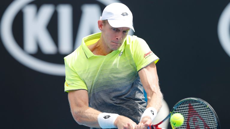 MELBOURNE, AUSTRALIA - JANUARY 15:  Kevin Anderson of South Africa plays a backhand in his first round match against Kyle Edmund of Great Britain on day on