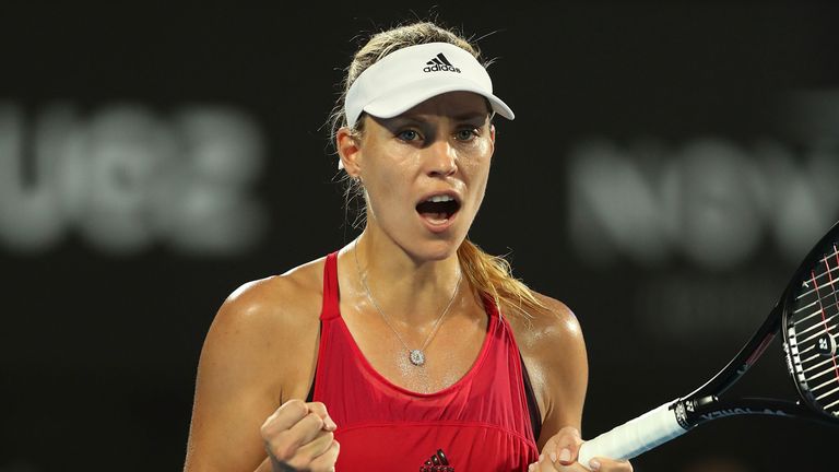 Angelique Kerber of Germany celebrates winning match point in her semi final match against Camila Giorgi of Italy