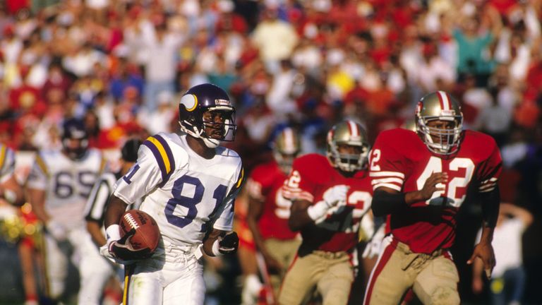 SAN FRANCISCO - OCTOBER 30:  Wide receiver Anthony Carter #81 of the Minnesota Vikings runs away from Ronnie Lott #42 of the San Francisco 49ers during a g