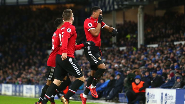 Anthony Martial of Manchester United celebrates with team mates after scoring his sides first goal during the Premier Lea