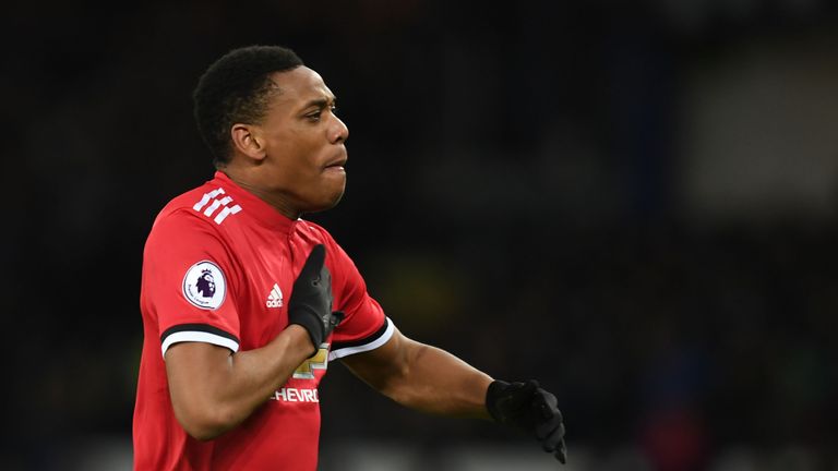 Anthony Martial thumps his chest after scoring the opening goal