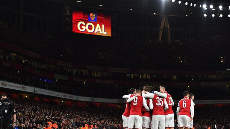 Arsenal's Spanish defender Nacho Monreal celebrates scoring the team's first goal during the League Cup semi-final football match between Arsenal and Chels
