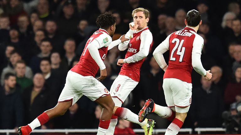 Arsenal's Spanish defender Nacho Monreal (C) celebrates scoring the team's first goal during the League Cup semi-final football match between Arsenal and C