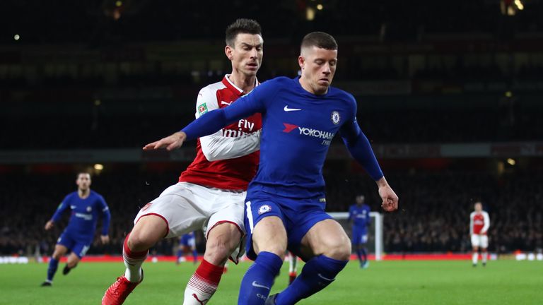 LONDON, ENGLAND - JANUARY 24:  Laurent Koscielny of Arsenal closes down Ross Barkley of Chelsea during the Carabao Cup Semi-Final Second Leg at Emirates St