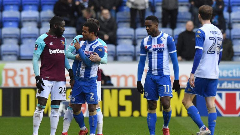 West Ham United's Arthur Masuaku (left) leaves the field after being sent-off during the Emirates FA Cup, fourth round match at the DW Stadium, Wigan.