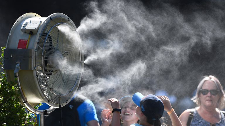 General view of fans cooling spectators in garden square on day three of the 2018 Australian Open at Melbourne Park