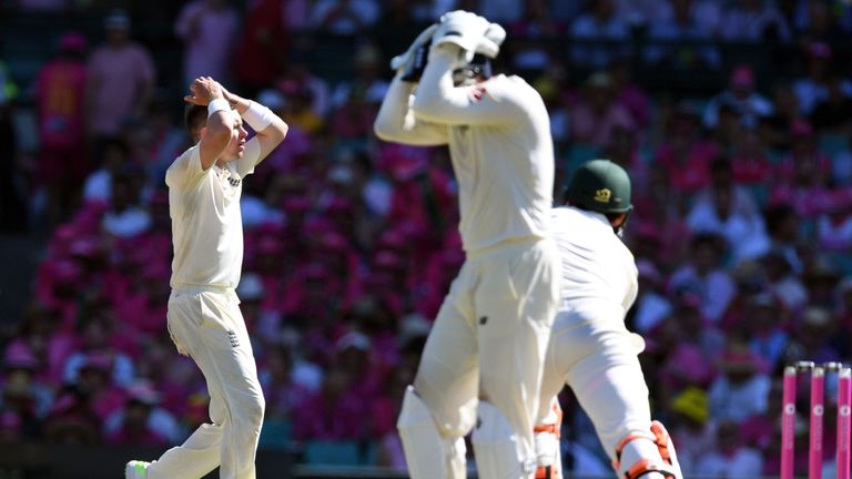 England's spinner Mason Crane (L) and wicketkeeper Jonny Bairstow (C) react after nearly dismissing Australia's Mitchell Marsh (R) on the third day of the 
