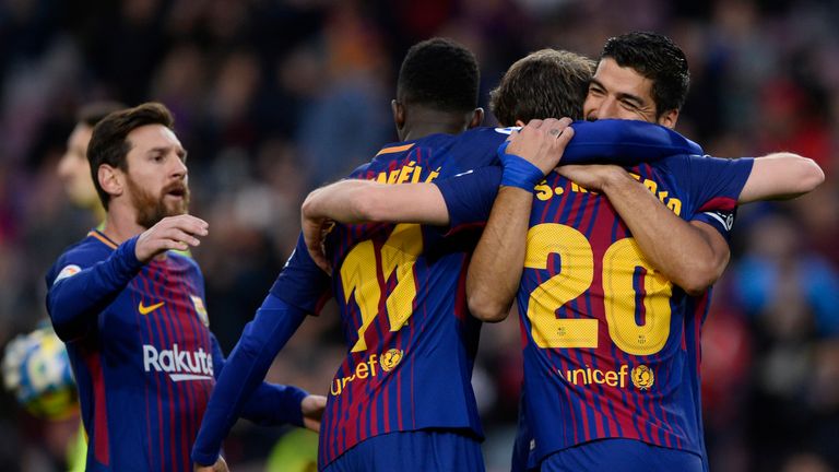 Barcelona's Uruguayan forward Luis Suarez (R) celebrates a goal with teammates during the Spanish league football match FC Barcelona vs Levante UD at the C