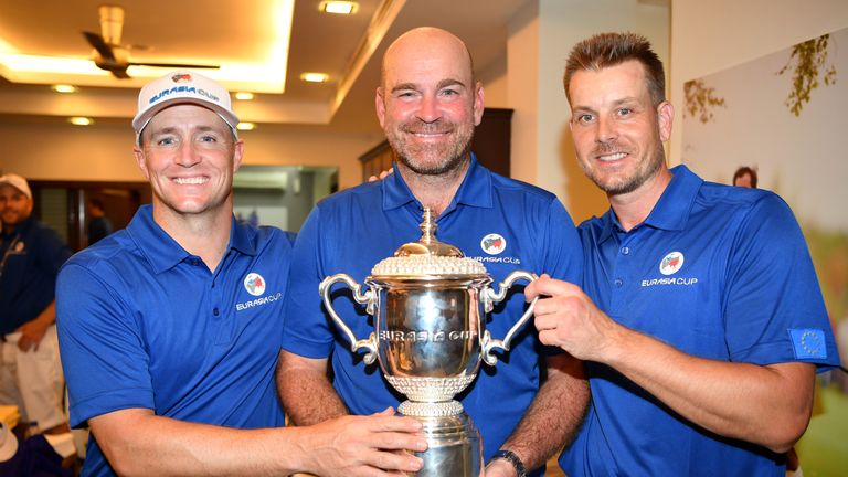 KUALA LUMPUR, MALAYSIA - JANUARY 14:  Europe Captain Thomas Bjorn poses with the trophy, Alex Noren and Henrik Stenson of Europe following his team's victo