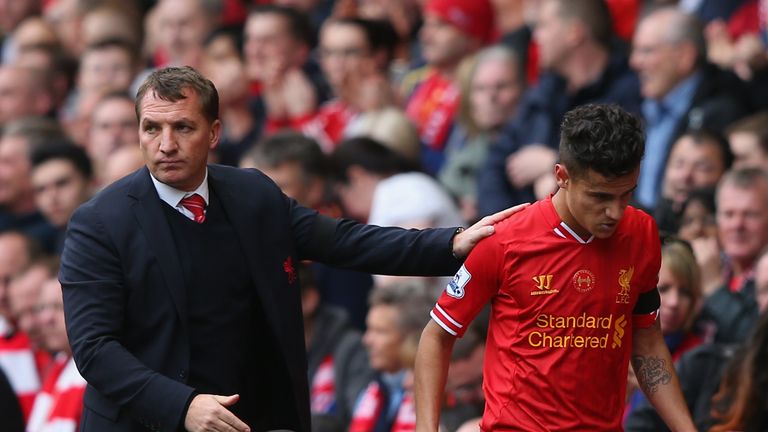 LIVERPOOL, ENGLAND - APRIL 13:  Liverpool Manager Brendan Rodgers congratulates Philippe Coutinho as he is substituted during the Barclays Premier League m