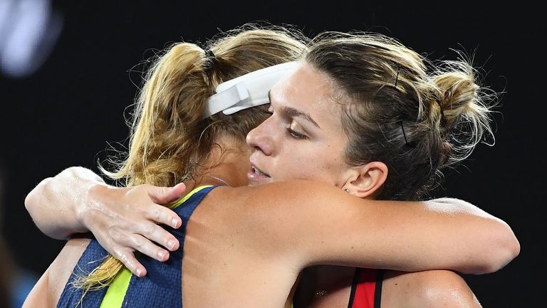 Simona Halep of Romania congratulates Caroline Wozniacki of Denmark after Wozniacki won their women's singles final