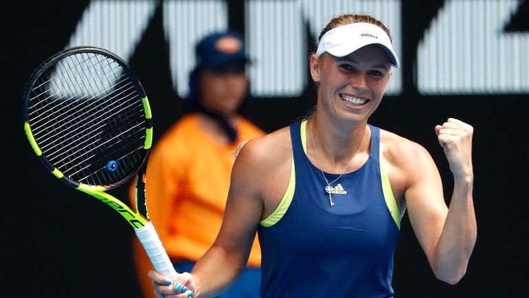 MELBOURNE, AUSTRALIA - JANUARY 21:  Caroline Wozniacki of Denmark celebrates winning her fourth round match against Magdalena Rybarikova of Slovakia on day
