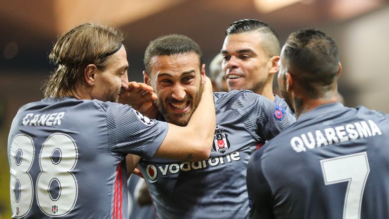 Cenk Tosun celebrates with team-mates Caner Erkin and Pepe