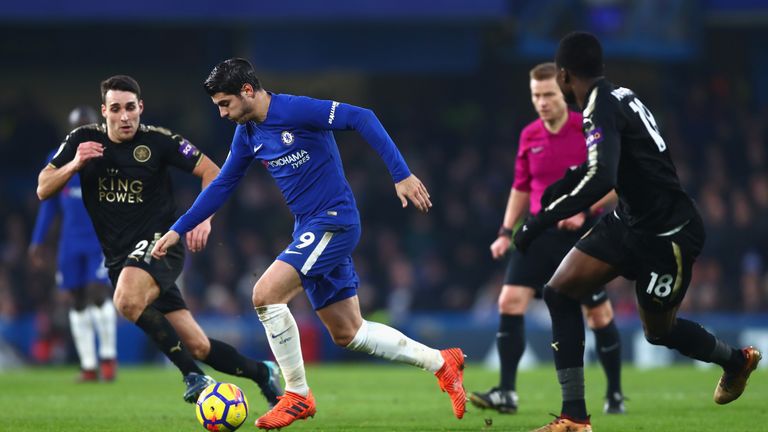LONDON, ENGLAND - JANUARY 13:  Alvaro Morata of Chelsea runs with the ball under pressure from Matty James and Daniel Amartey of Leicester City during the 