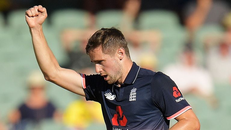 England's Chris Woakes celebrates dismissing Australia opener David Warner, at Adelaide