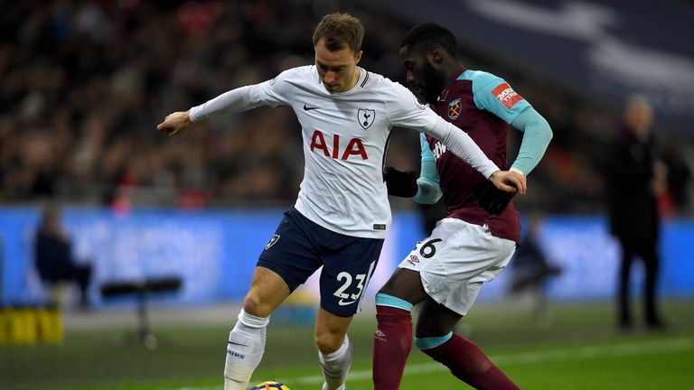 Christian Eriksen is challenged by Arthur Masuaku