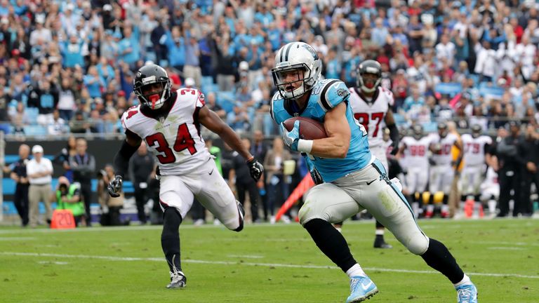 CHARLOTTE, NC - NOVEMBER 05: Christian McCaffrey #22 of the Carolina Panthers runs for a touchdown against the Atlanta Falcons in the second quarter during