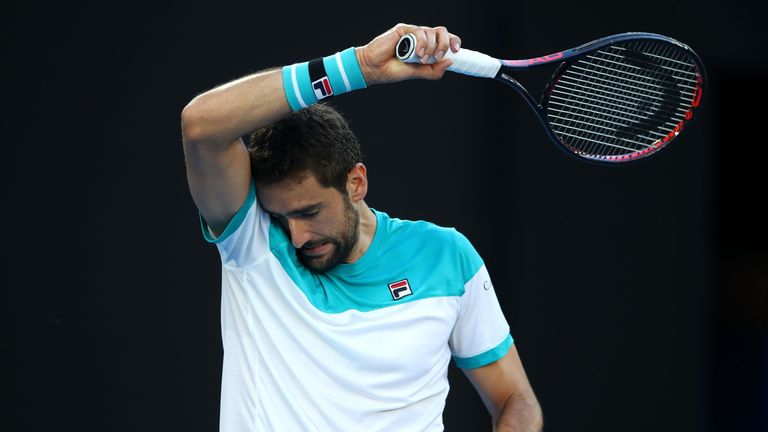 MELBOURNE, AUSTRALIA - JANUARY 23:  Marin Cilic of Croatia prepares to serve in his quarter-final match against Rafael Nadal of Spain on day nine of the 20