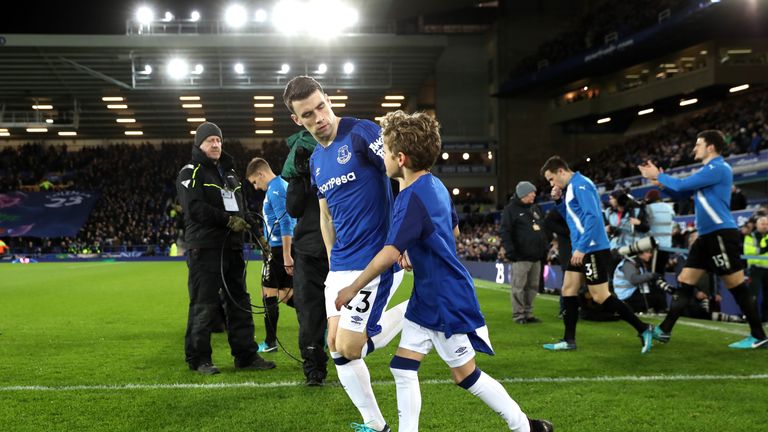 LIVERPOOL, ENGLAND - JANUARY 31:  Seamus Coleman of Everton walks out with a mascot prior to the Premier League match between Everton and Leicester City at