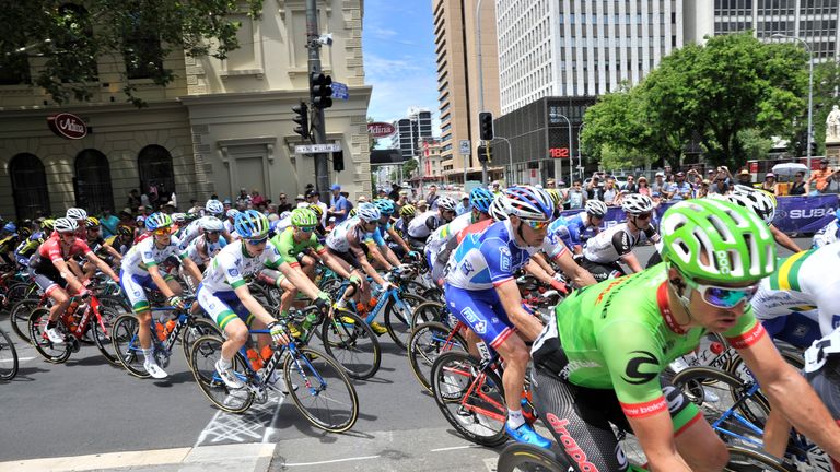 The peloton rides through the streets during stage six of the Tour Down Under in Adelaide on January 22, 2017