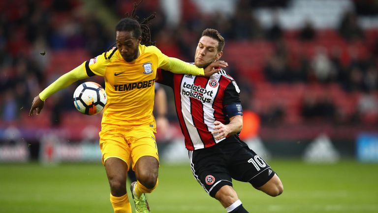 SHEFFIELD, ENGLAND - JANUARY 27:  Daniel Johnson of Preston North End is challenged by Billy Sharp of Sheffield United during The Emirates FA Cup Fourth Ro