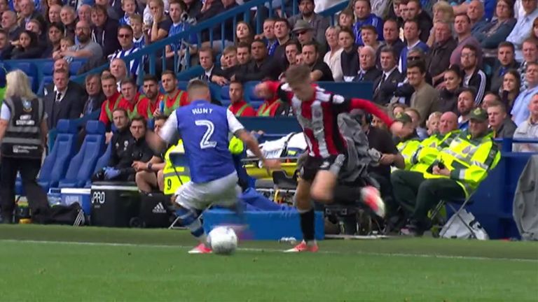 United's David Brooks nutmegs Wednesday's Jack Hunt during the Steel City derby - an image Chris Wilder has in his office at Bramall Lane