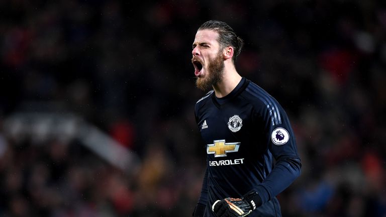 David De Gea celebrates his side's second goal against Stoke City at Old Trafford