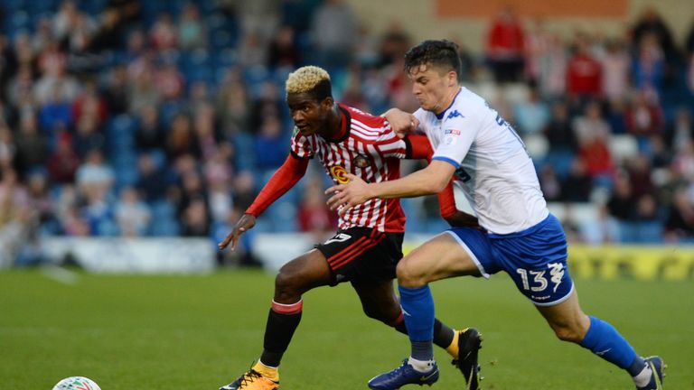 BURY, ENGLAND - AUGUST 10: Didier Ndong of Sunderland and Callum Reilly of Bury in action during the Carabao Cup First Round match between Bury and Sunderl