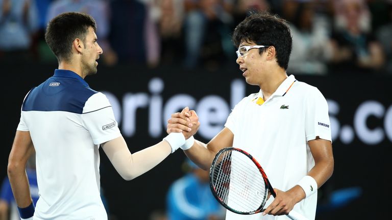 MELBOURNE, AUSTRALIA - JANUARY 22:  Novak Djokovic of Serbia congratulates Hyeon Chung of South Korea after losing their fourth round match on day eight of