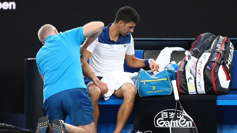 MELBOURNE, AUSTRALIA - JANUARY 22:  Novak Djokovic of Serbia receives medical treatment in his fourth round match against Hyeon Chung of South Korea on day