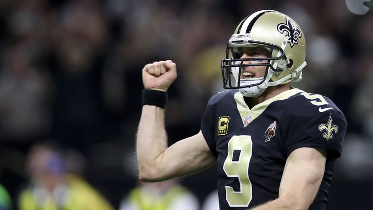 NEW ORLEANS, LA - JANUARY 07:  Drew Brees #9 of the New Orleans Saints reacts after throwing a touchdown pass against the Carolina Panthers at the Mercedes