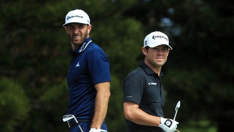 LAHAINA, HI - JANUARY 07:  Dustin Johnson of the United States and Brian Harman of the United States look on from the second tee during the final round of 