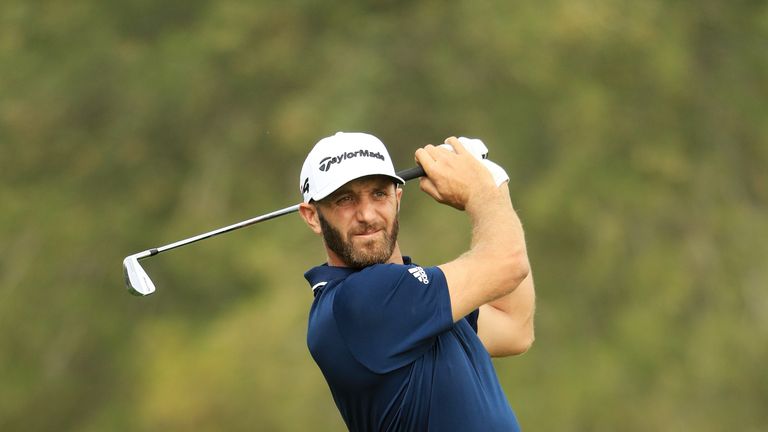 Dustin Johnson of the United States plays his second shot on the second hole during the final round of the Abu Dhabi Championship