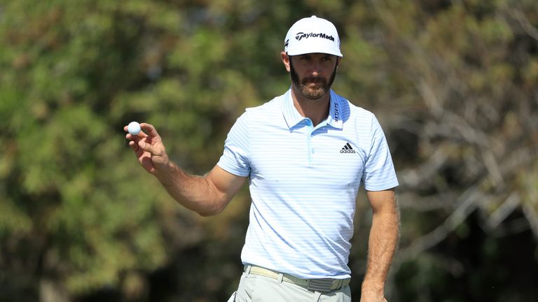 ABU DHABI, UNITED ARAB EMIRATES - JANUARY 19:  Dustin Johnson of the United States reacts on the first green during round two of the Abu Dhabi HSBC Golf Ch