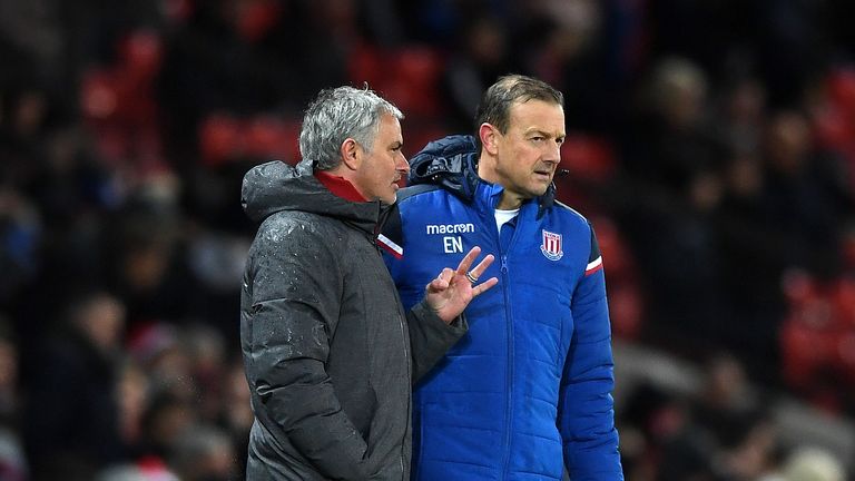 MANCHESTER, ENGLAND - JANUARY 15:  Jose Mourinho, Manager of Manchester United speaks with Eddie Niedzwiecki of Stoke City during the Premier League match 