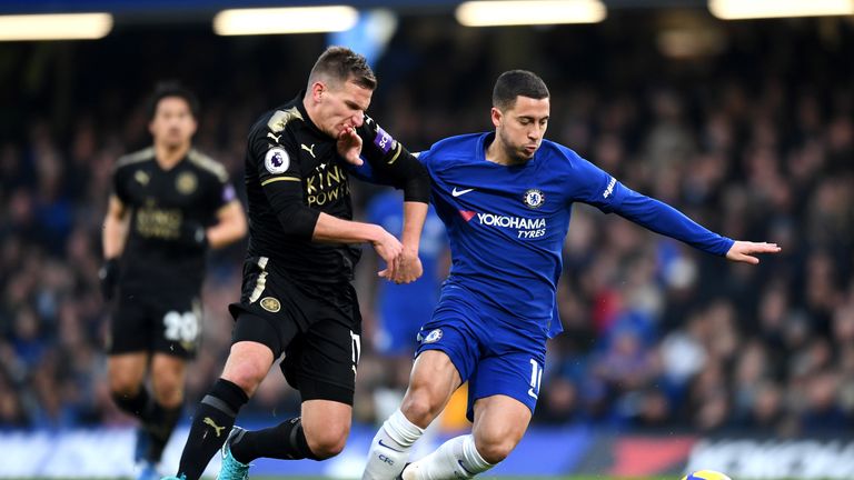 LONDON, ENGLAND - JANUARY 13: Eden Hazard of Chelsea is challenged by Marc Albrighton of Leicester City during the Premier League match between Chelsea and