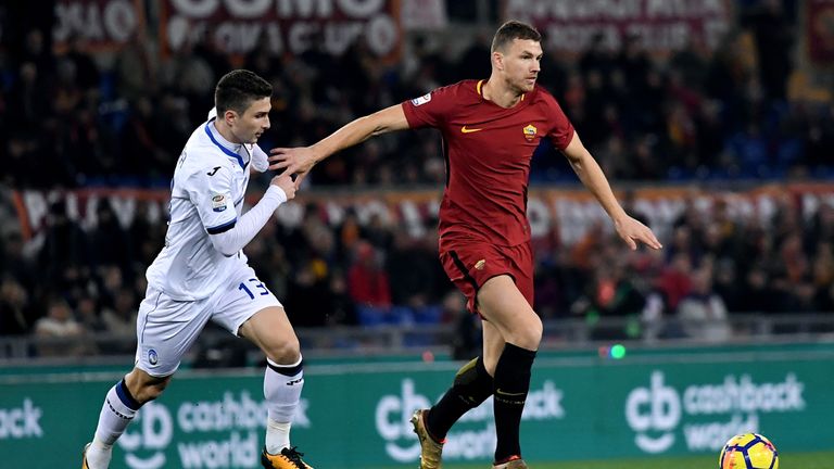 Atalanta's Italian defender Mattia Caldara  fights for the ball with Roma's forward Edin Dzeko during the Serie A football match 